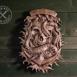 a wooden carving of an octopus with a skull-like face, set against a green wooden background.