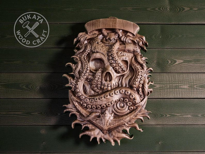 a wooden carving of an octopus with a skull-like face, set against a green wooden background.