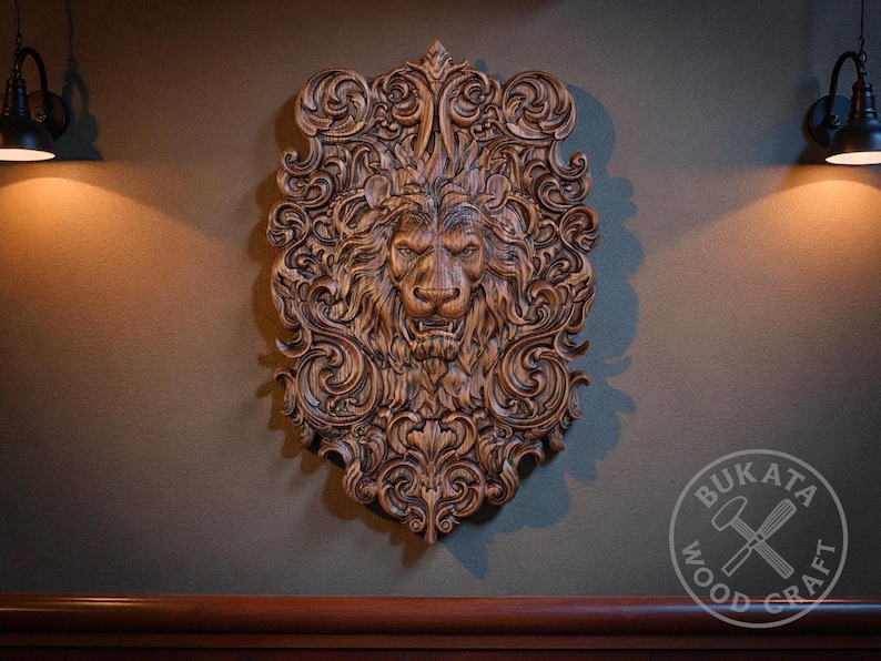 a large, intricately carved lion head mounted on a wall, with two lights on either side of it.