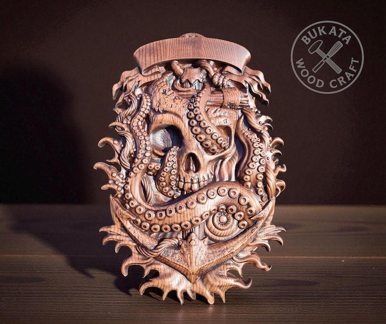 a wooden sculpture of a skull with tentacles, which appears to be a carved piece of art.
