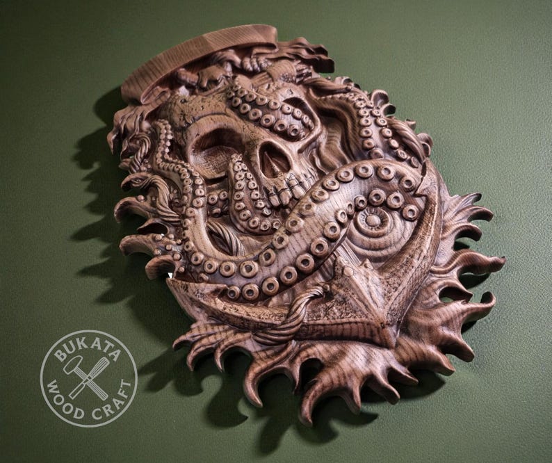 a wooden sculpture of an octopus with a skull-like face, set against a green background.