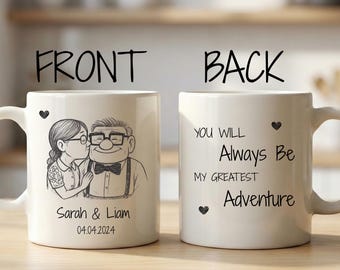 May include: White ceramic mug featuring a black and white illustration of a couple kissing, with the names "Sarah & Liam" and the date "04.04.2024" below. The back of the mug has the text "You Will Always Be My Greatest Adventure".
