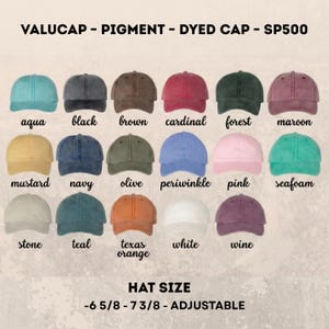 May include: A display of pigment-dyed baseball caps in various colors, including aqua, black, brown, cardinal, forest, and maroon. Additional colors are mustard, navy, olive, periwinkle, pink, seafoam, stone, teal, texas orange, white, and wine. The hats are adjustable and come in sizes 6 5/8 - 7 3/8.