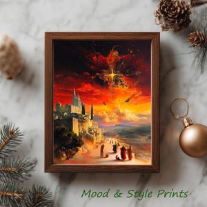 Puede incluir: Una impresión enmarcada con una dramática escena de atardecer. La obra de arte representa una ciudad con altas agujas y figuras con túnicas, bajo un cielo rojo y naranja. El texto "Mood & Style Prints" está en la parte inferior.