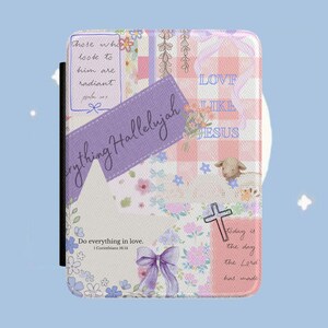 May include: A rectangular e-reader cover featuring a collage of pastel pink and white gingham, floral patterns, and purple ribbons. Text includes "Everything Hallelujah," "Love like Jesus," "Those who look to him are radiant," and "Do everything in love."