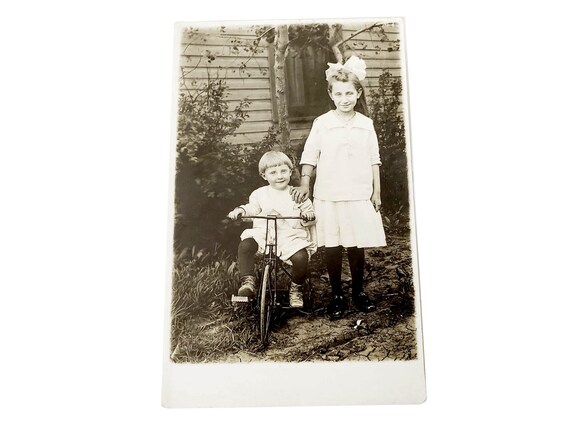 Vintage French postcard of young boy on his tricycle Vintage French postcard of young boy on his tricycle