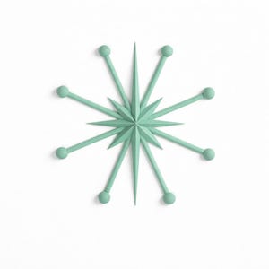 Könnte beinhalten: Ein minzgrünes Wandobjekt in Sternform mit einem zentralen, vielzackigen Stern und acht strahlenförmig angeordneten, dünnen Armen, die jeweils in einer kleinen Kugel enden. Das Design ist symmetrisch, geometrisch und weist eine klare, dreidimensionale Struktur auf.