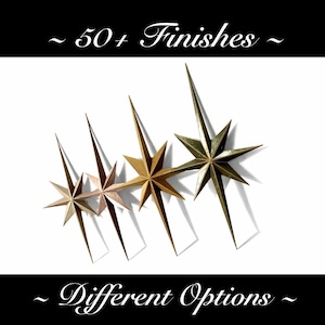 May include: Four star-shaped decorative objects in varying metallic finishes, including gold and bronze, are arranged against a white background. The image includes the text "~ 50+ Finishes ~" and "~ Different Options ~".