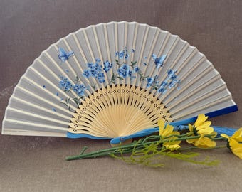 Openwork bamboo fans, and handcrafted bamboo fansperfect for cooling off in the summer and as photo props for wedding favors