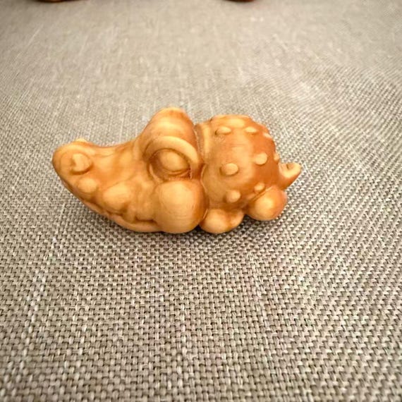 Hand-carved wooden alligator figurine that looks like a real craftsperson's weekend project — chunky, characterful, and totally desk-worthy.