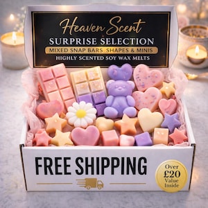 May include: A box filled with colorful soy wax melts in various shapes, including bars, hearts, stars, and a teddy bear. The box has the text "Heaven Scent" and "Surprise Selection". The melts are in shades of pink, purple, and yellow.