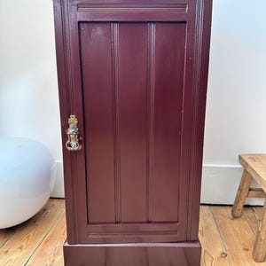 Restored vintage cupboard painted in burgundy