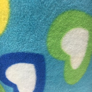 Fleece multi heart on blue  fabric by the yard