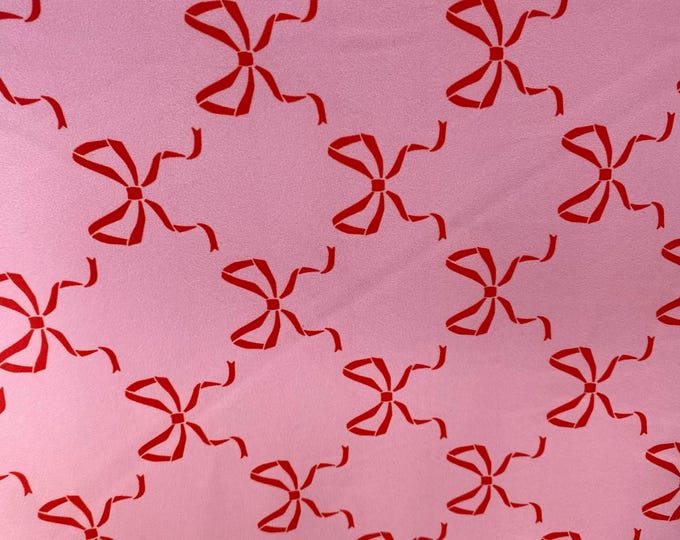 Red bows on pink spandex 4  way  fabric by the yard