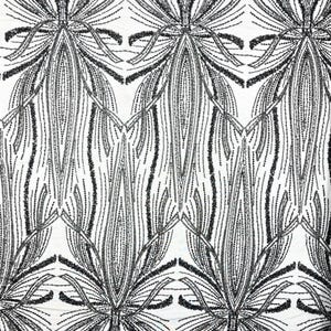 May include: A white fabric featuring a repeating black sequin pattern. The design consists of elongated, pointed leaf-like shapes arranged in a symmetrical, vertical layout. Each shape is outlined and filled with fine, shimmering black sequins.