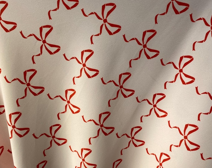 Red bows on ivory spandex 4  way  fabric by the yard