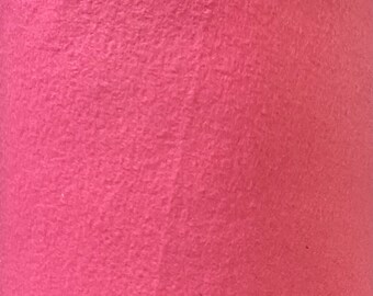 May include: A close-up of a soft, pink fabric with a fuzzy texture.