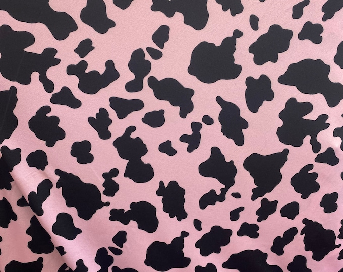 Black Cow on pink 4 way stretch spandex fabric 60 inches wide