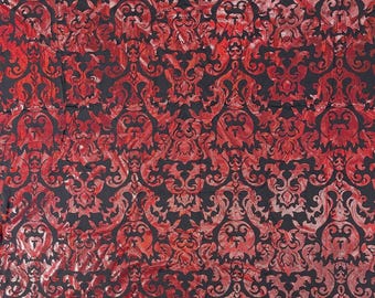 Tissu spandex damassé holographique rouge et noir extensible dans les 4 sens et irisé
