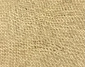 May include: A close-up of a beige burlap fabric with a woven texture.