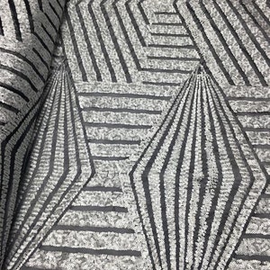 May include: Silver sequins on black mesh fabric create a geometric pattern of intersecting lines and diamonds.