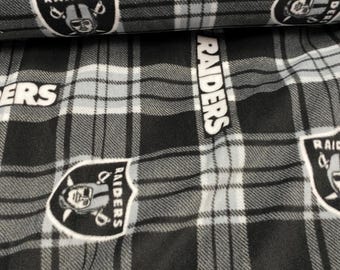 Tela polar suave y cálida con estampado de los Oakland Raiders de la NFL.