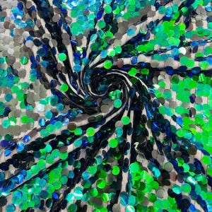 May include: A fabric featuring a dense arrangement of circular, iridescent sequins in shades of bright green, deep blue, and silver. The sequins are attached to a sheer, light-colored mesh base, creating a swirling, textured pattern across the surface.