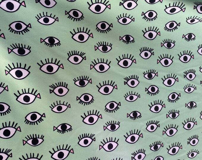 Fish eye on blue Nylon Spandex fabric 60” wide