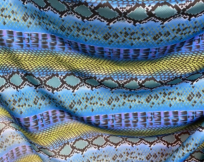 sapphire exotic snake design print on  4-way stretch 58/60” Sold by the YD.