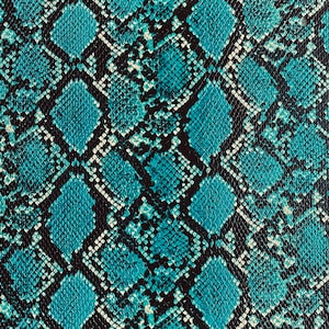 May include: A close-up of a blue and black snakeskin pattern. The pattern is made up of small, overlapping scales.