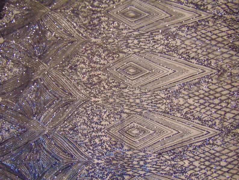 May include: Purple and silver sequined fabric with a geometric pattern. The fabric has a mesh backing.