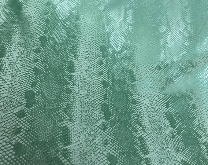 Green matte stretch vinyl fabric costumes, leggings, clothing  Sold by the Yard.