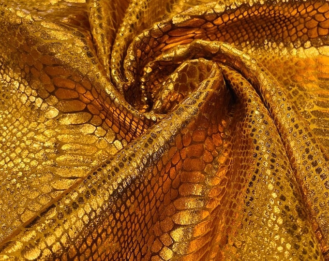 Cinnamon foil Snake design on a stretch velvet fabric-Sold by the yard.