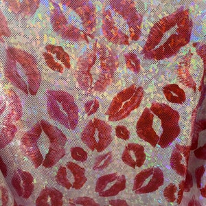 May include: Red lips printed on a white iridescent fabric with a mesh texture.