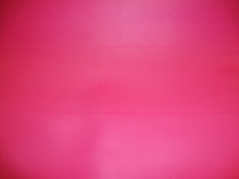 May include: A solid, bright pink background.