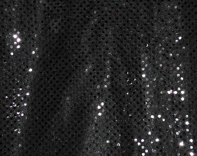 Black Sequin dot 45 inches wide sold by the yard