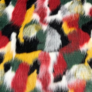 May include: Close-up of a fuzzy fabric with a camouflage pattern in red, yellow, green, white, and black.