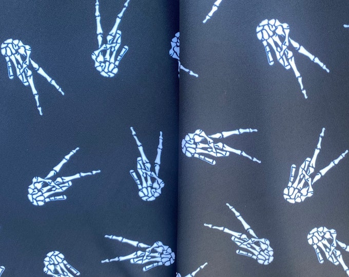 Skeleton hand on black Nylon Spandex Fabric dance swimsuits 60” wide