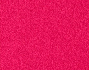May include: A close-up shot of a vibrant, solid-colored, hot pink felt fabric. The texture is slightly rough and uneven, with a dense, matted appearance. The color is consistent across the entire surface, creating a bold and eye-catching visual.