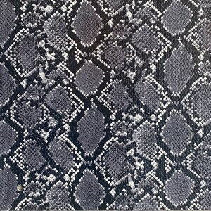 May include: Black and white snakeskin pattern fabric. The pattern is a repeating design of small, diamond-shaped scales.