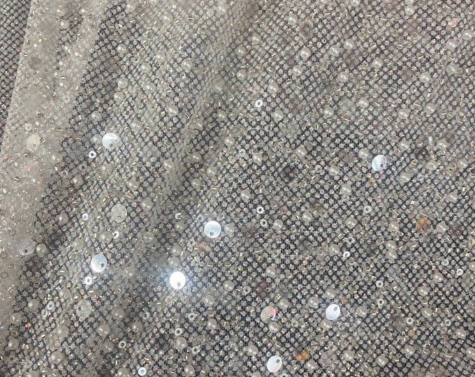 Ivory beaded sequins and pearls on mesh fabric, 54 inches wide