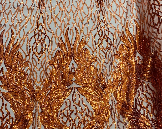 Orange damask sequin on stretch nude mesh fabirc 54” wide
