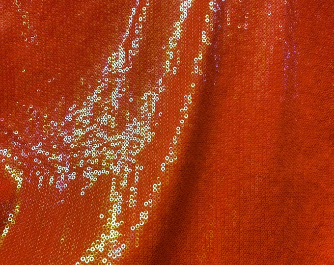 Iridescent Orange sequin glitz on stretch polyeste 2-way 58/60” wide