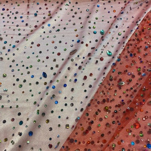 Beaded multicolored, rhinestone gems, on red mesh fabric, 54 inches wide