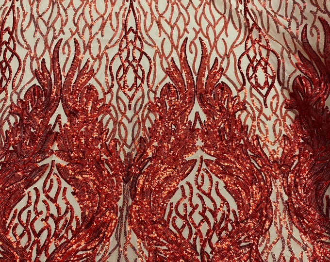 Red damask sequin on stretch nude mesh fabirc 54” wide