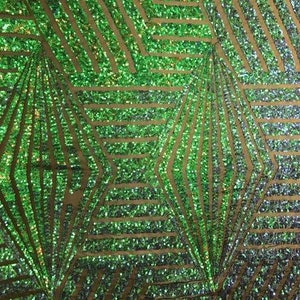 May include: Green and gold iridescent sequins in a geometric pattern on a mesh fabric. The sequins are arranged in a repeating pattern of diamonds and stripes.