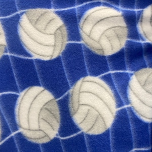 Volleyball Fleece on blue 60” wide By The Yard