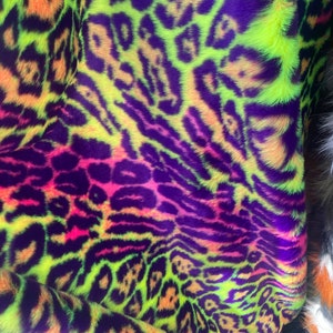 Multi colored Leopard Spotted shaggy short pile faux fur fabric by the yard
