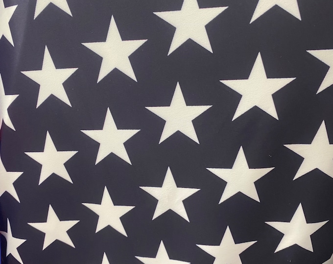 Beige stars black Spandex trixot 4 way stretch fabric 58" wide