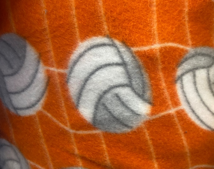 Volleyball Fleece on orange 60” wide By The Yard